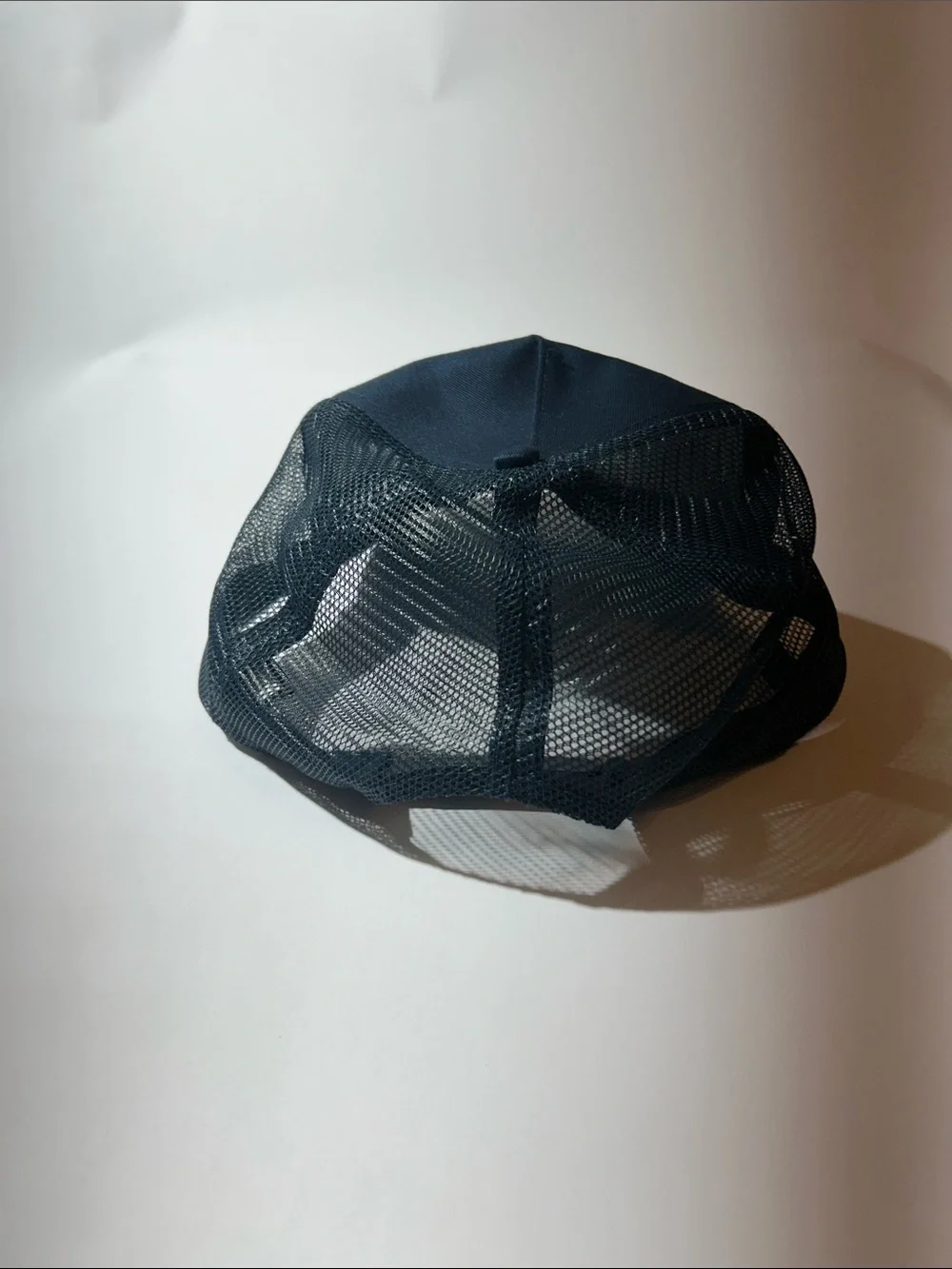 Port Authority Navy Blue Trucker Cap with White Logo